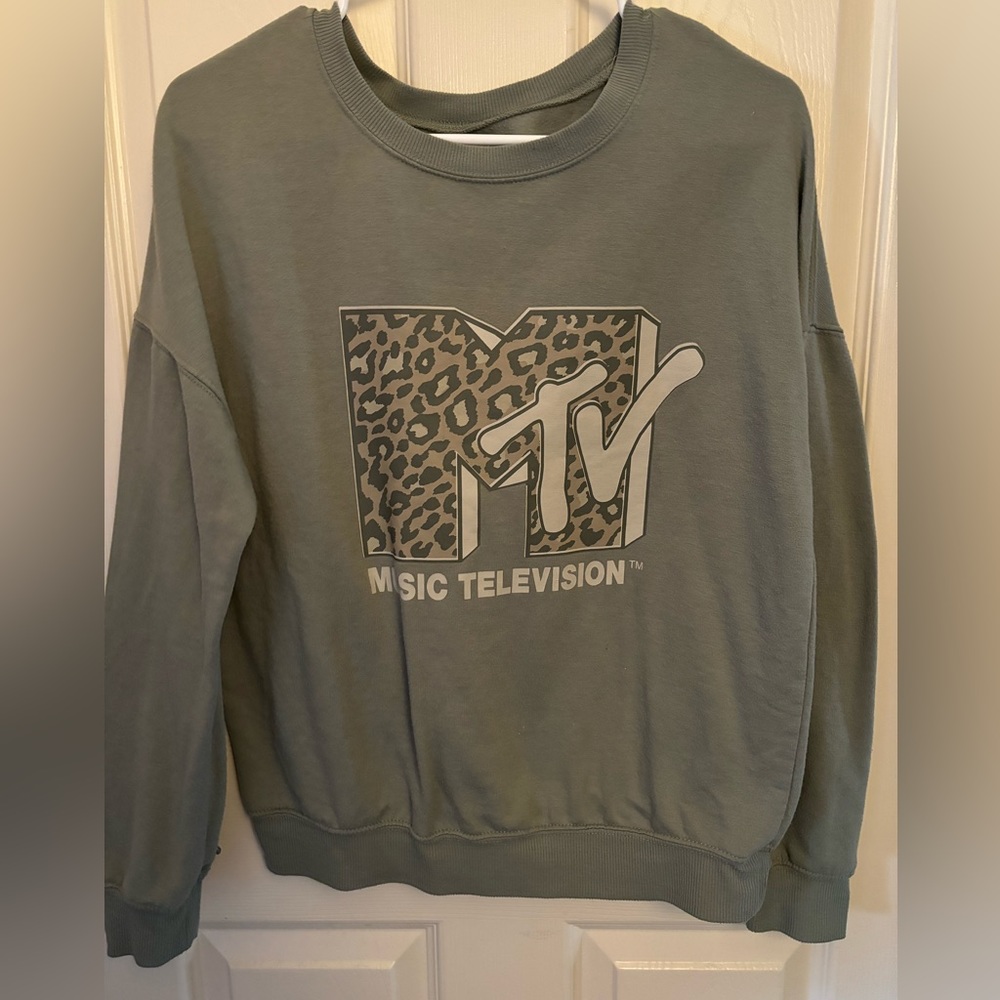 Olive green crewneck, with a cute MTV graphic with cheetah print on the front.